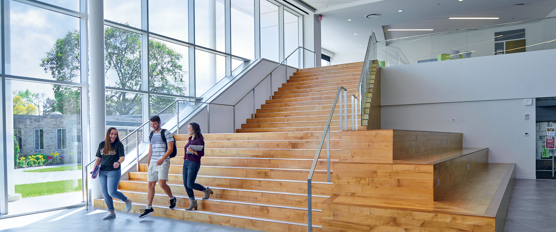 photo of a group of students walking down a staircase