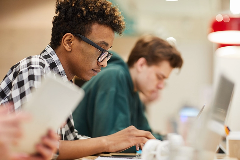 photo of students working at computers